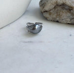Platinum gray saltwater keshi pearl with an organic silhouette in a sterling silver ring.