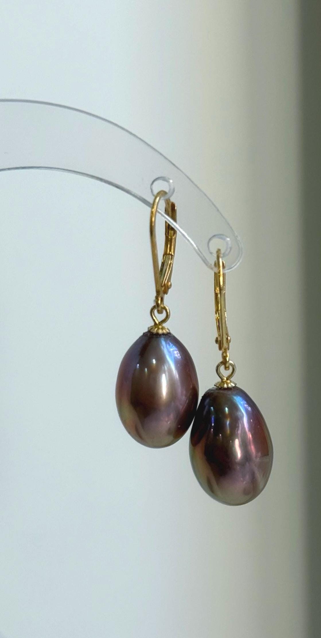 Genuine freshwater pearl earrings with a warm rose gold hue