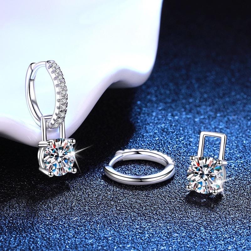 Sterling silver huggie hoop earrings with round moissanite drops