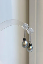 Sterling silver dangle earrings featuring silver gray Tahitian pearls