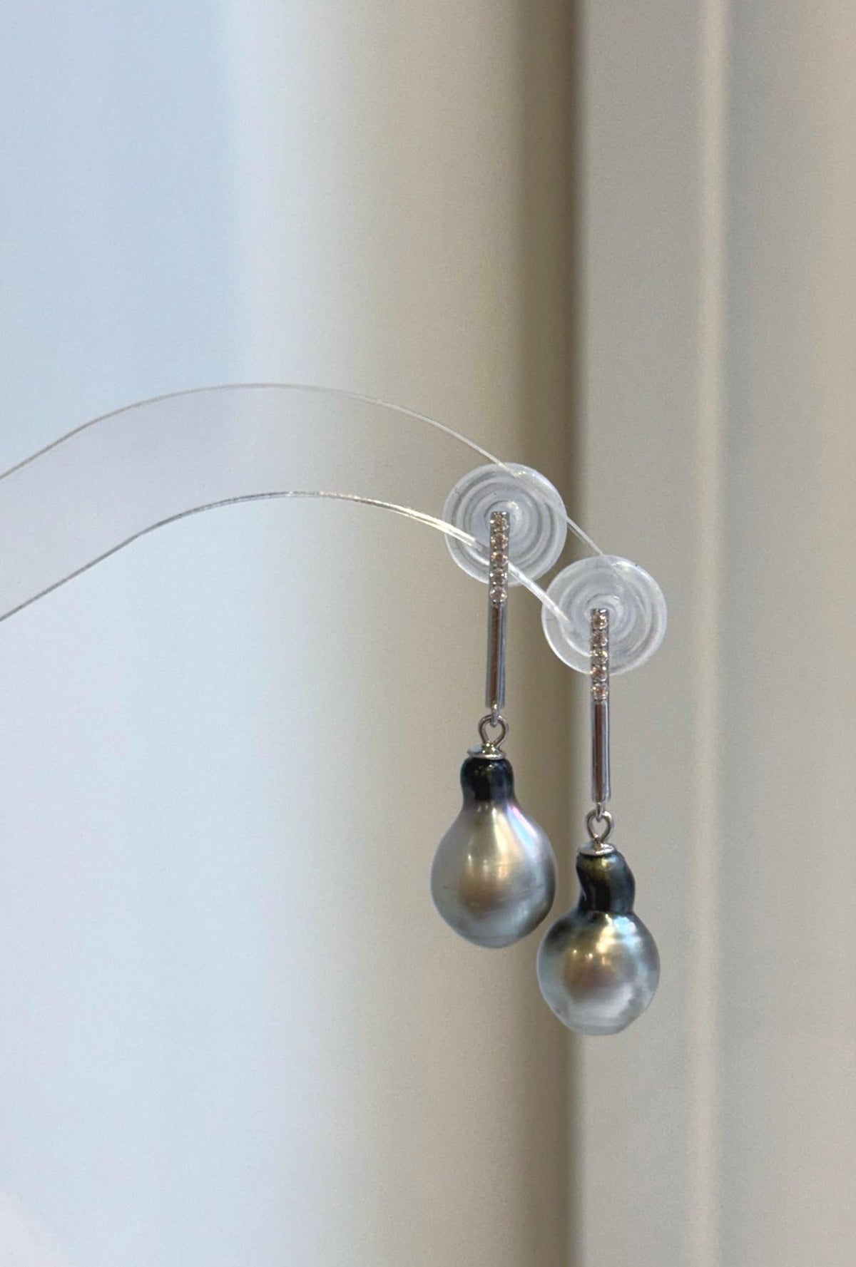 Sterling silver dangle earrings featuring silver gray Tahitian pearls
