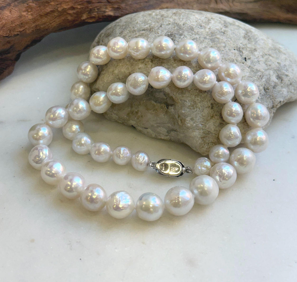 Hand-knotted pearl necklace featuring graduated white pearls