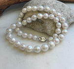 Elegant graduated pearl choker with reflective mirror luster