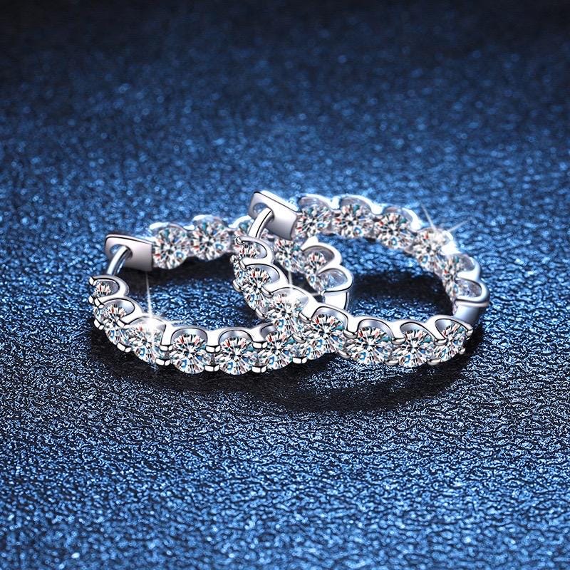 Sterling silver hoops featuring 1.3 carats diamond equivalent of moissanite each.