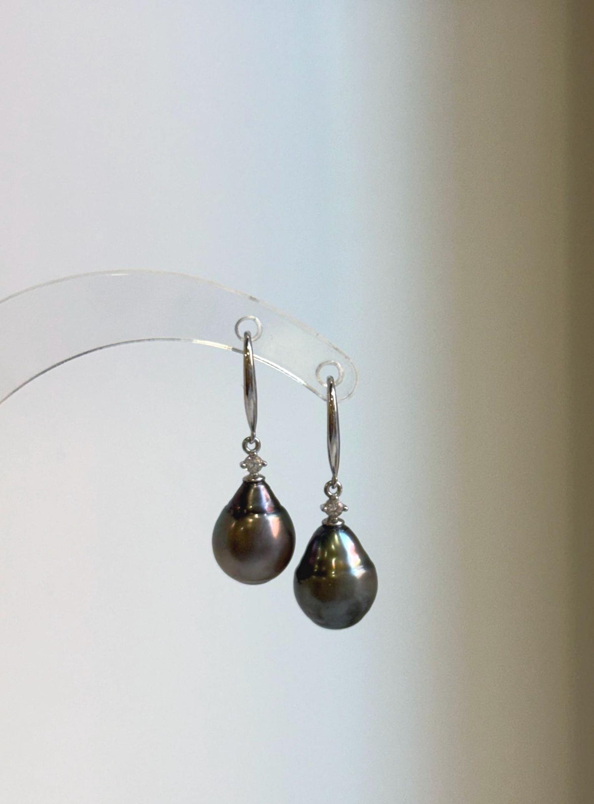 Hook earrings featuring 9.6mm hunter brown Tahitian saltwater pearls and sterling silver hooks.