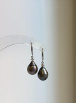 Hook earrings featuring 9.6mm hunter brown Tahitian saltwater pearls and sterling silver hooks.