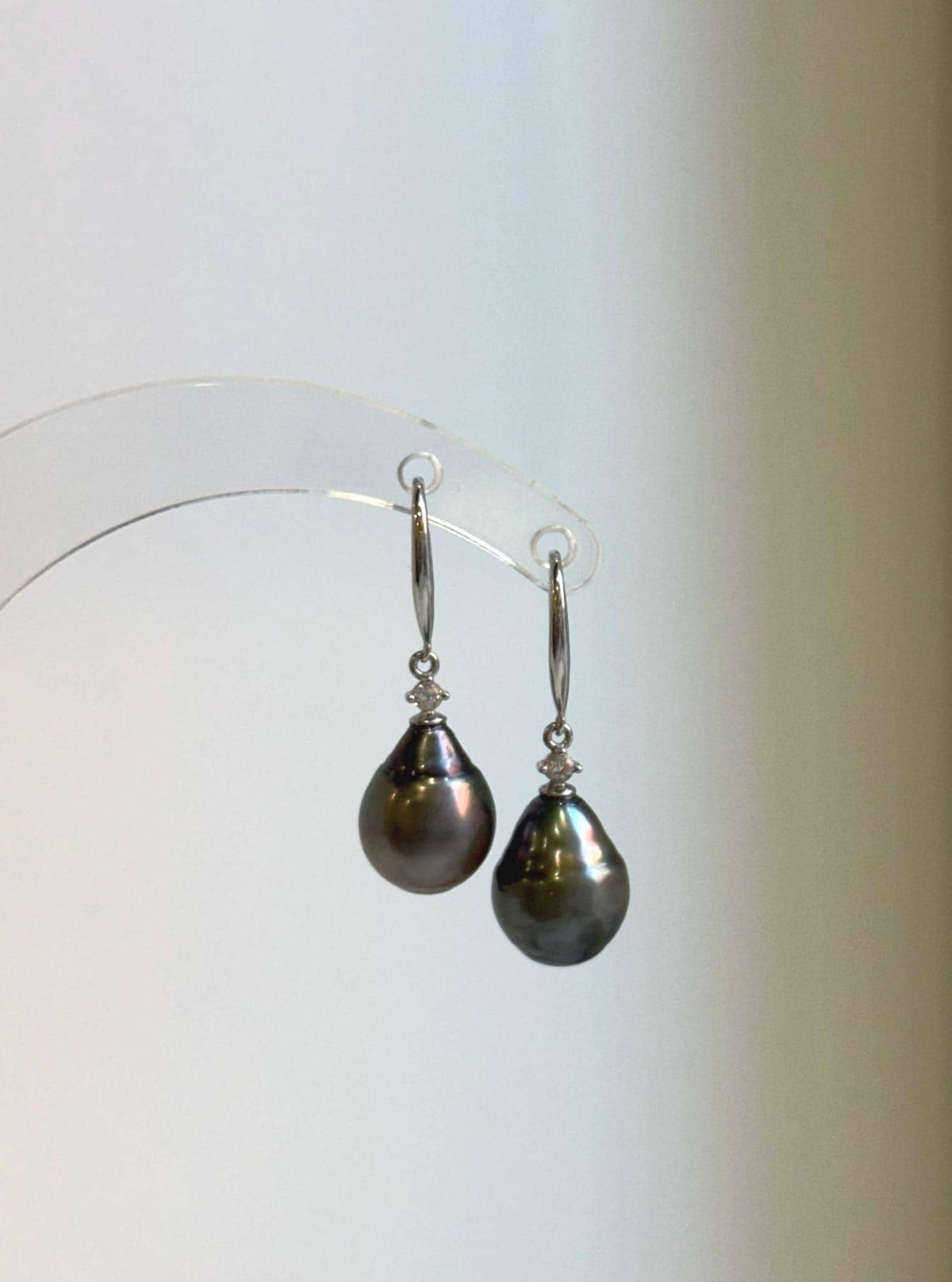 Elly’s Tahitian saltwater pearl earrings with hunter brown pearls and sterling silver hooks.