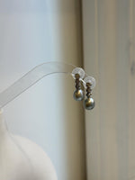 Lustrous 9mm gray pearls suspended from S925 sterling silver links with an overlapping ribbon design.
