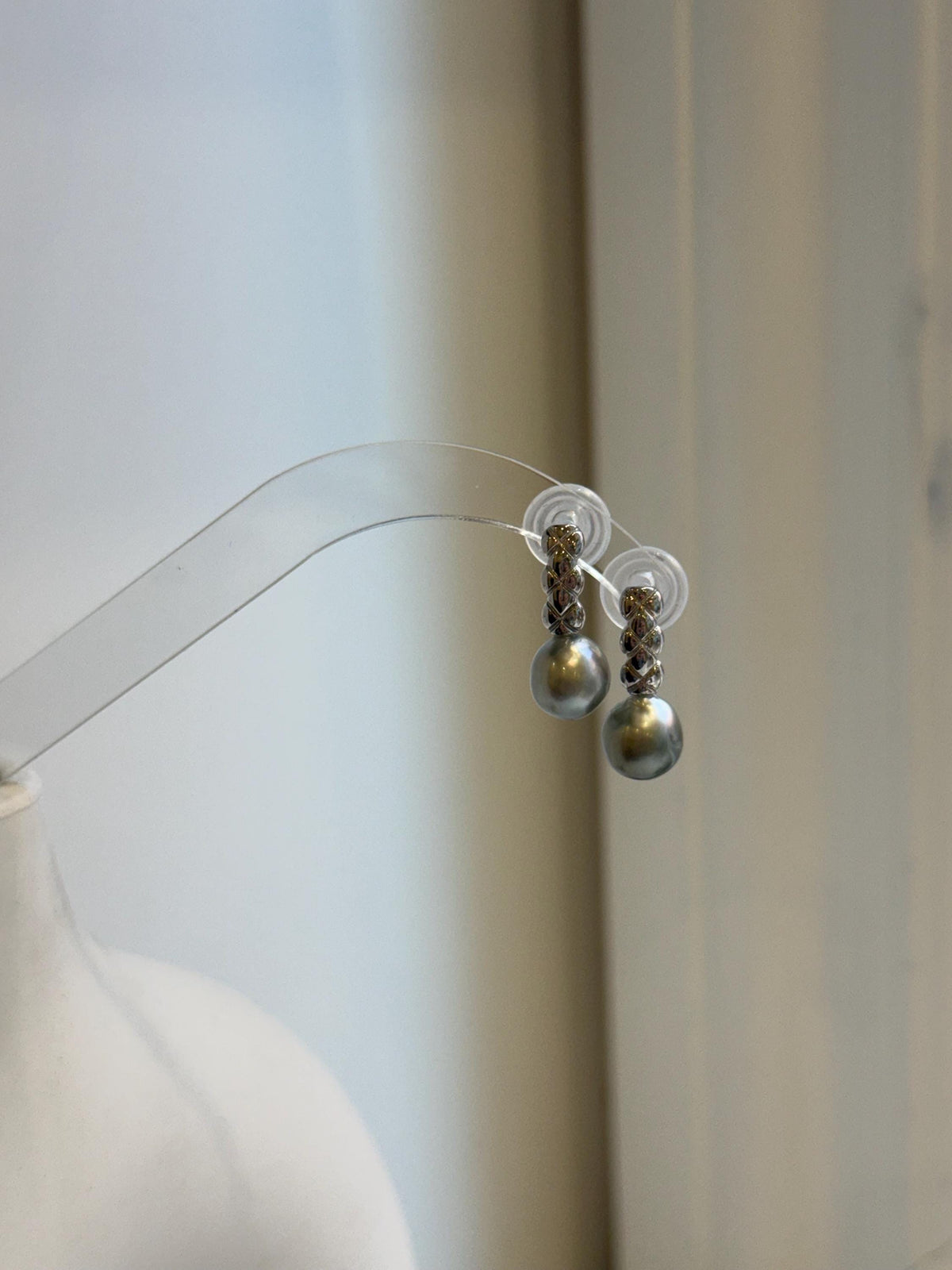 9mm gray pearl dangle earrings featuring stacked S925 sterling silver crisscross details above each pearl.