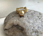 Elly’s adjustable South Sea pearl ring featuring warm tea-gold color, bright luster and a gold-plated silver lace band.