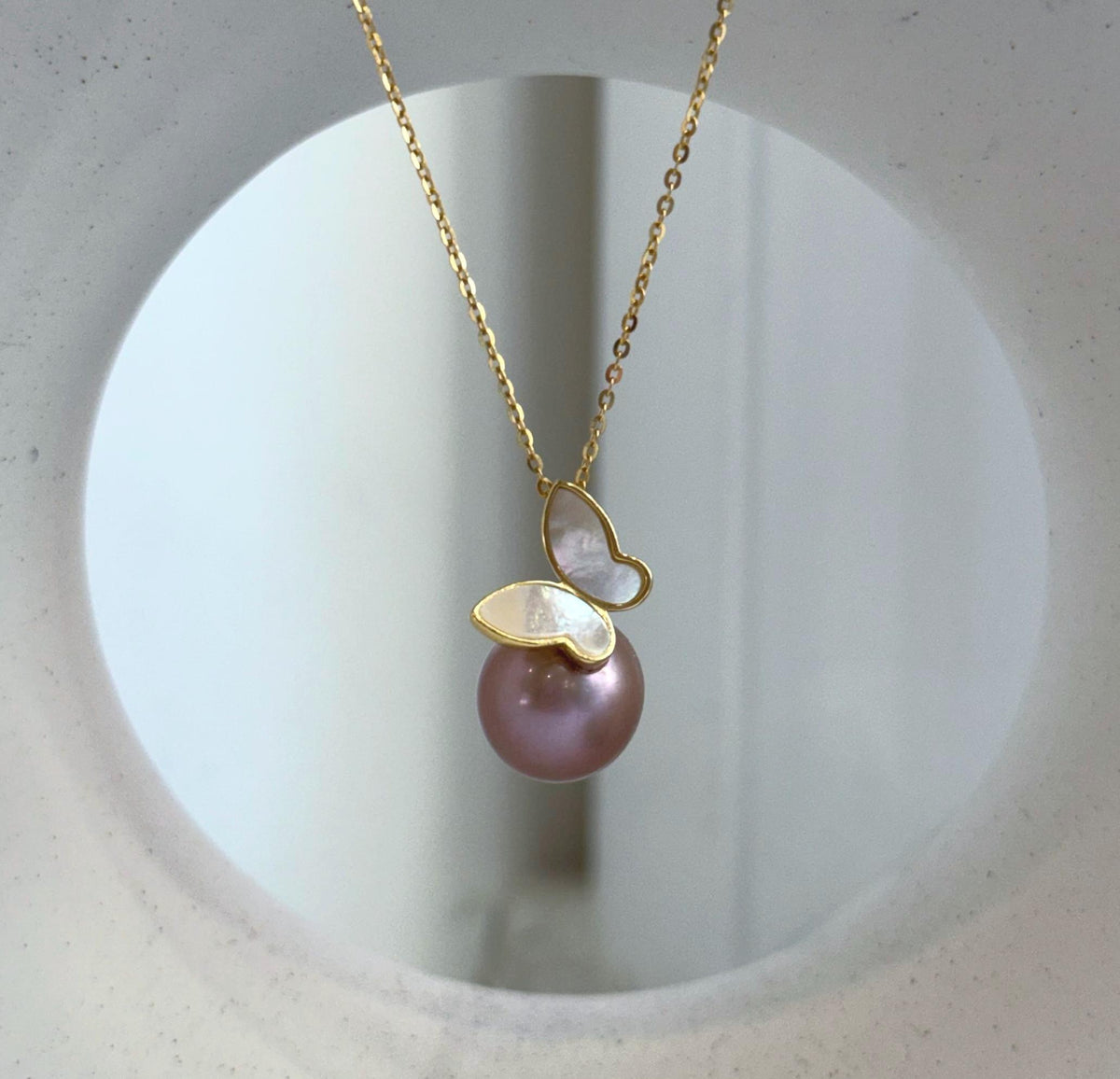 S925 sterling silver butterfly pendant featuring a genuine 12.2mm Edison pearl.