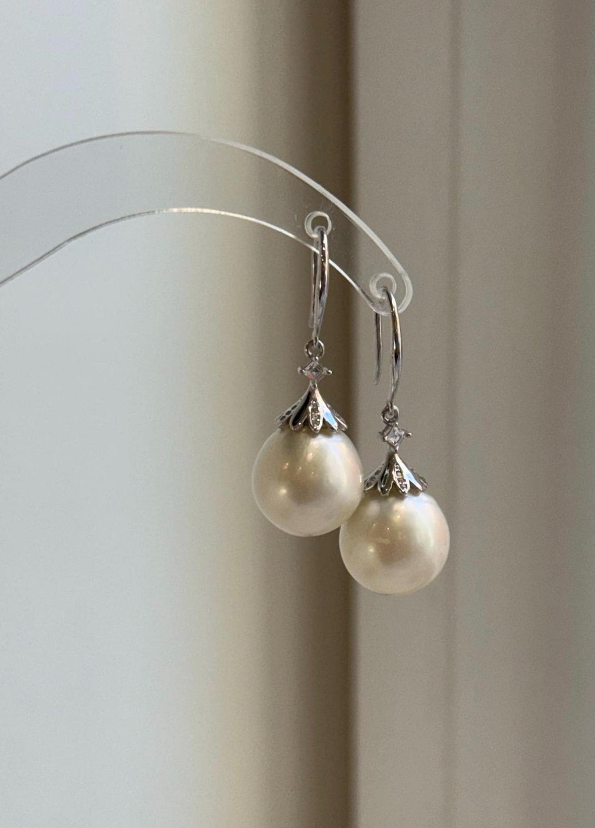 Elly’s Australian white pearl drop earrings with S925 sterling silver settings.