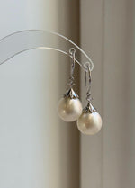 Elly’s Australian white pearl drop earrings with S925 sterling silver settings.