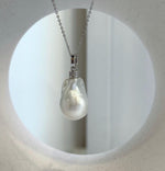 13.7x19.7mm saltwater pearl with extreme luster in a sterling silver setting.