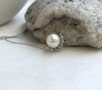 South Sea pearl necklace featuring an 11.1mm white pearl and a crescent-shaped S925 silver setting.