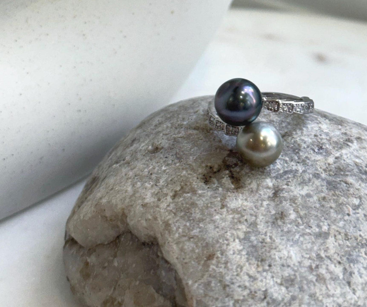 Taupe green Tahitian pearls with mirror luster paired in a sterling silver ring.
