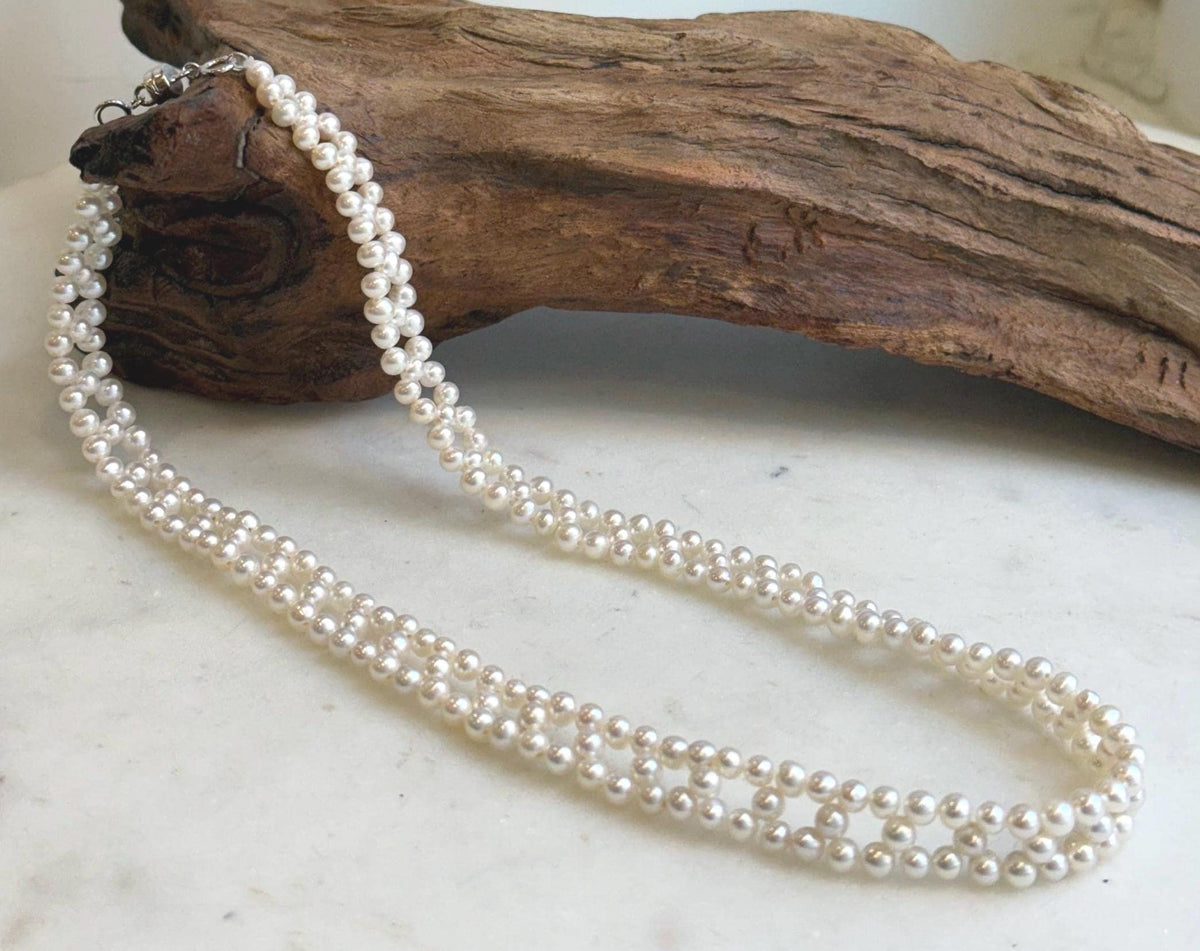 White pearl lace choker measuring approximately 40.7cm long.