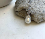 Butterfly ocean pearl necklace with sparkling clear accents.
