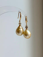 S925 sterling silver hook earrings featuring golden saltwater pearls.