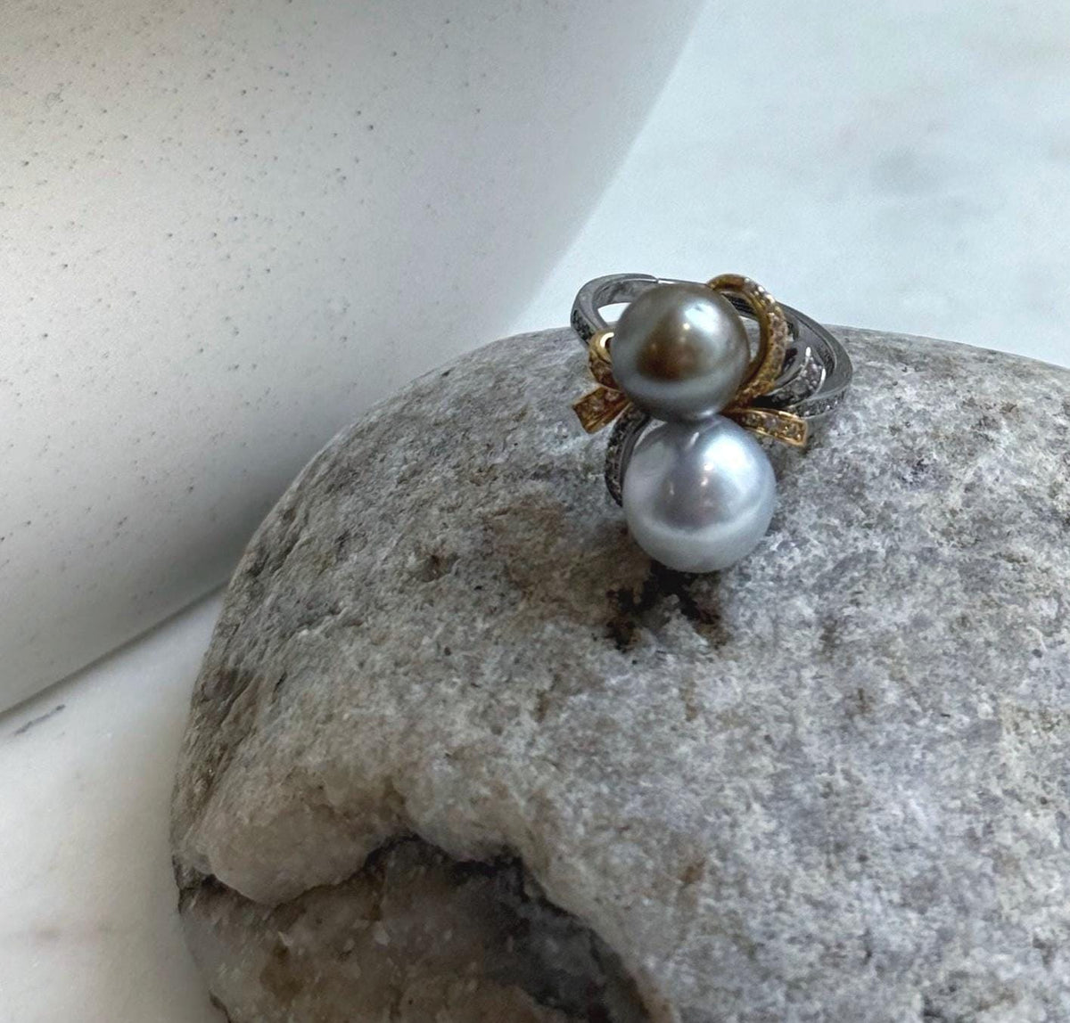 S925 sterling silver floral setting with two Tahitian pearl accents.