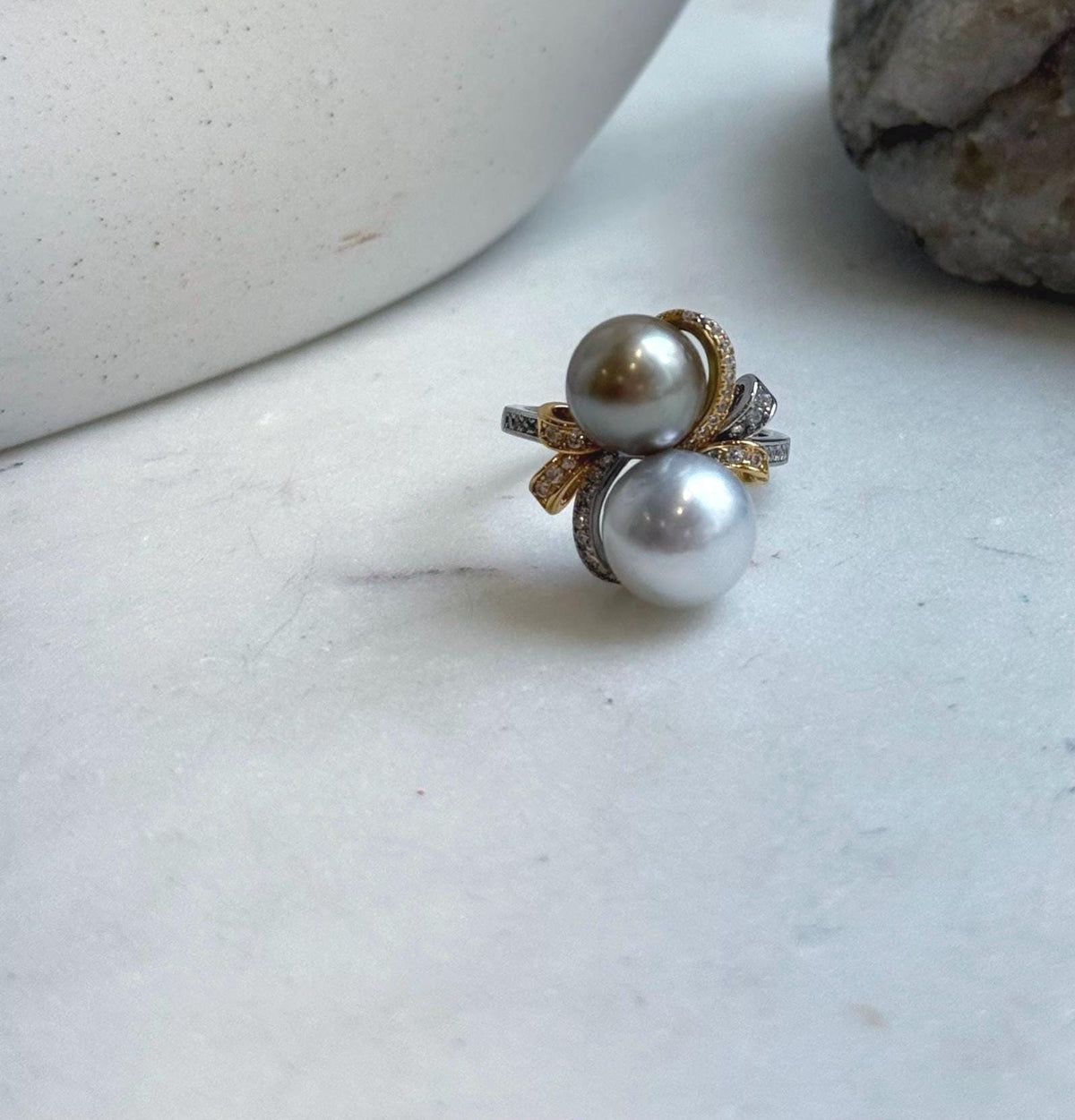 Mirror-luster Tahitian pearls in soft silver and taupe tones.