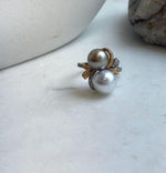 Mirror-luster Tahitian pearls in soft silver and taupe tones.