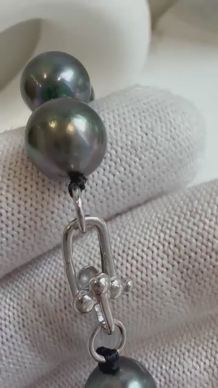 Elly’s 9.8-11.5mm 15pcs Tahitian Ocean peacock black hunter Pearls Bracelet: Extreme luster mirrored, 8.1” knotted. Pearl jewelry idea.